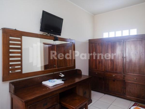 Wisma Garuda Syariah Condoongcatur Mitra RedDoorz : photo 10 de la chambre chambre lits jumeaux standard