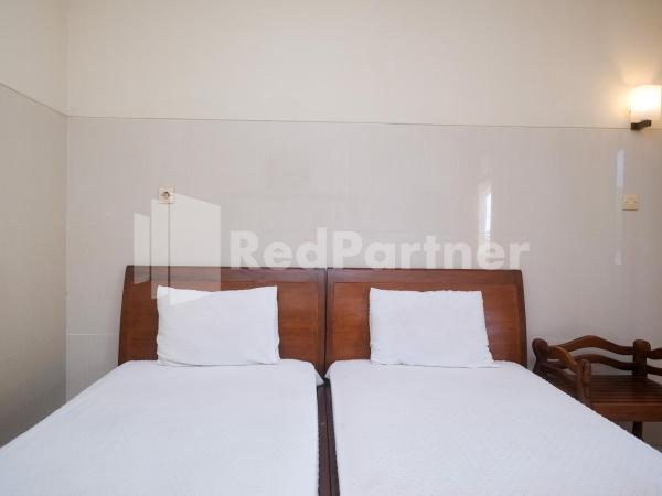 Wisma Garuda Syariah Condoongcatur Mitra RedDoorz : photo 4 de la chambre chambre lits jumeaux standard