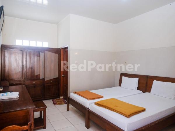 Wisma Garuda Syariah Condoongcatur Mitra RedDoorz : photo 2 de la chambre chambre lits jumeaux standard
