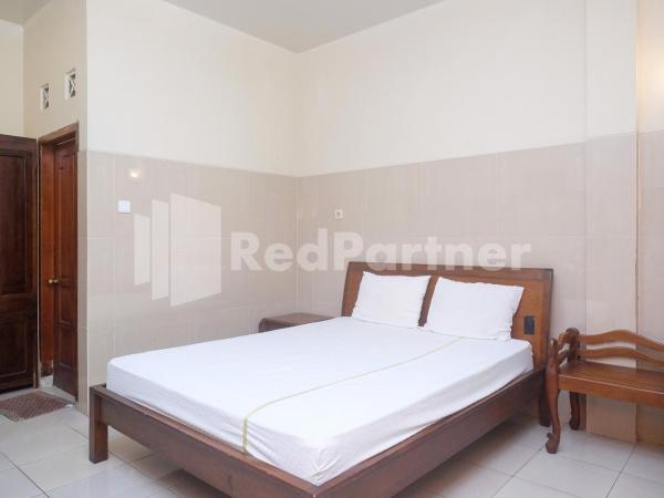 Wisma Garuda Syariah Condoongcatur Mitra RedDoorz : photo 10 de la chambre chambre double standard