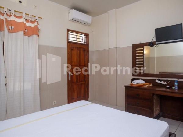 Wisma Garuda Syariah Condoongcatur Mitra RedDoorz : photo 6 de la chambre chambre double standard