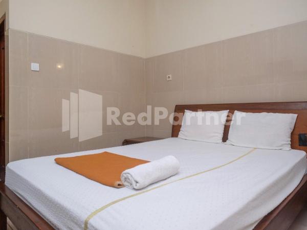Wisma Garuda Syariah Condoongcatur Mitra RedDoorz : photo 2 de la chambre chambre double standard