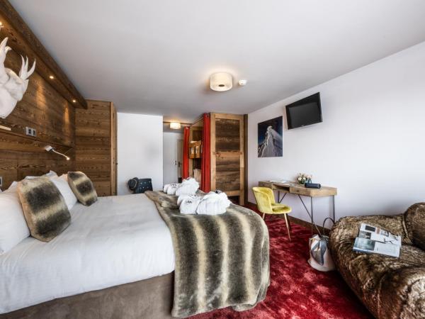 Hôtel Ski Lodge - Village Montana : photo 1 de la chambre chambre quadruple avec balcon pour 3 adultes (13 ans et plus)