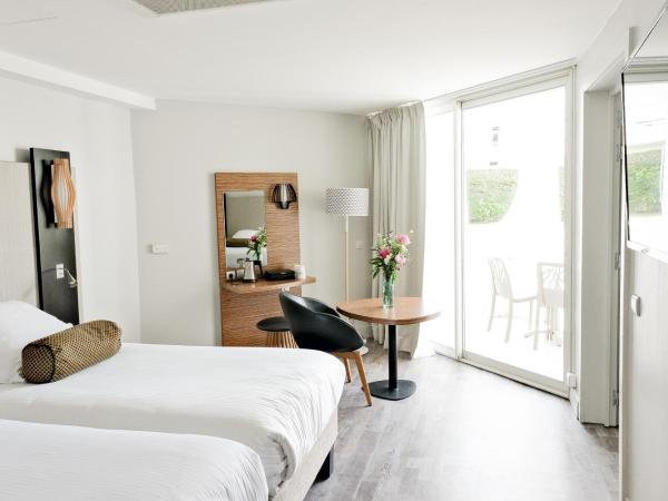 Thalazur Port-Camargue - Hotel & Spa : photo 4 de la chambre chambre lits jumeaux - vue latérale sur jardin