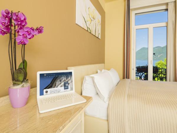 Hotel Victoria : photo 4 de la chambre chambre lit king-size - vue sur lac