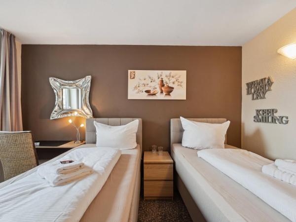 7o'Clock - Hannover Laatzen : photo 2 de la chambre chambre double ou lits jumeaux