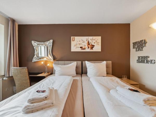 7o'Clock - Hannover Laatzen : photo 1 de la chambre chambre double ou lits jumeaux