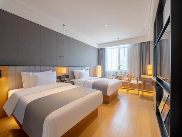 Pero Hotel Qingdao Expo City : photo 1 de la chambre chambre affaires lits jumeaux