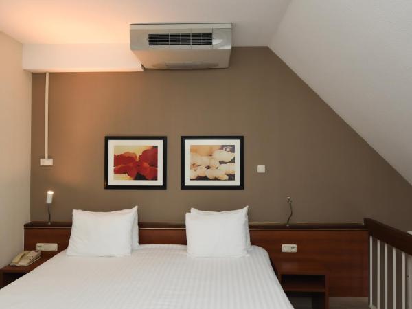 Crowne Plaza Maastricht, an IHG Hotel : photo 1 de la chambre suite queen junior avec 2 lits queen-size