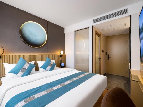 East Sacred Hotel - very close to the Drum tower And Nanluoguxiang Houhai Bar Very close to the bird's nest water cube : photo 1 de la chambre chambre lit queen-size deluxe