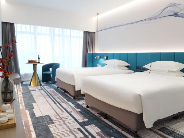 Asia International Hotel Guangdong : photo 1 de la chambre chambre lits jumeaux exécutive