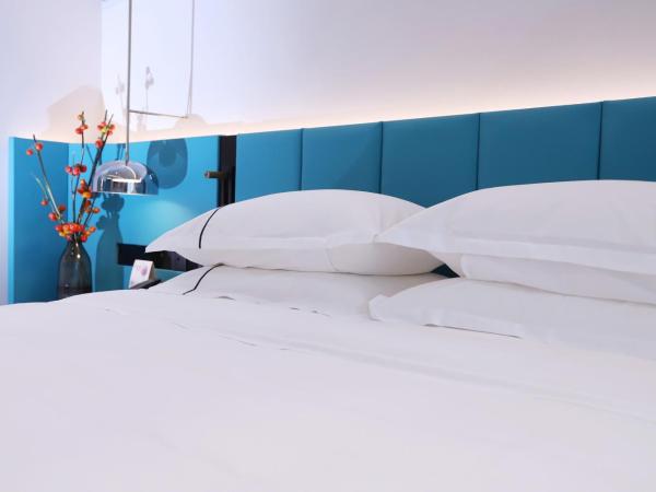 Asia International Hotel Guangdong : photo 3 de la chambre chambre lit queen-size Élite