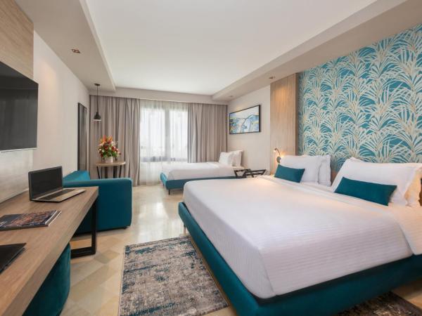 Golden Tulip El Mechtel : photo 1 de la chambre chambre business avec 1 lit king-size et 1 lit simple