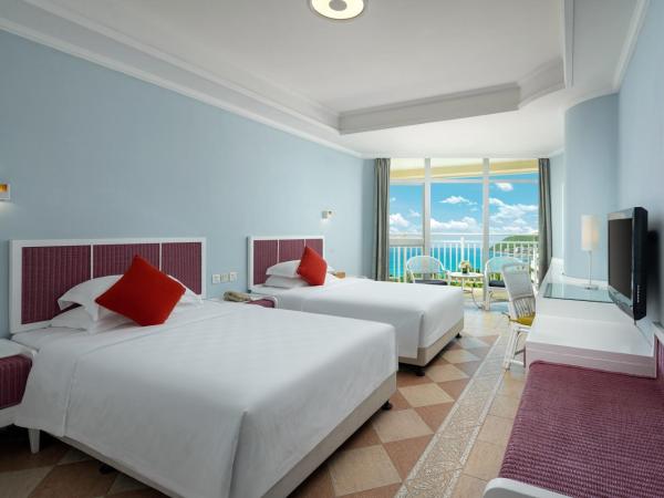 Sunshine Resort Intime Sanya : photo 2 de la chambre chambre double ou lits jumeaux avec balcon - vue sur mer