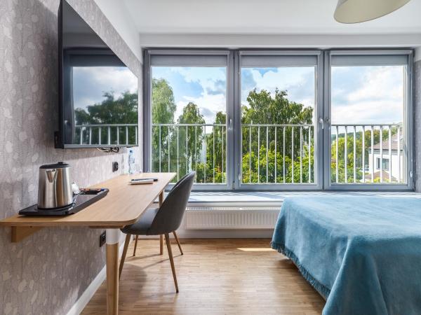 Grand Tulipan : photo 1 de la chambre chambre simple - vue sur ville