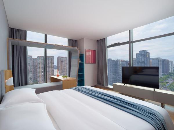 Pagoda Hotel Hangzhou Binjiang : photo 3 de la chambre chambre double exécutive - vue sur rivière