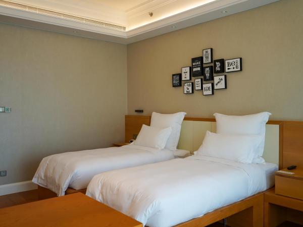 Residence G Nanshan : photo 1 de la chambre chambre double ou lits jumeaux avec douche