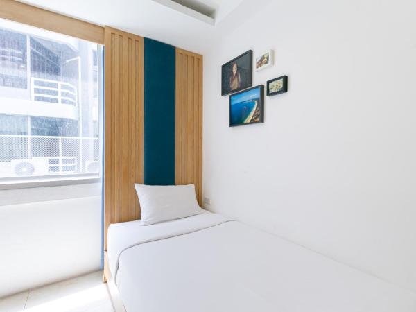 The Bedrooms Hostel Pattaya : photo 1 de la chambre chambre lits jumeaux standard avec salle de bains commune