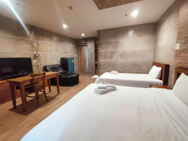 Komol Residence Bangkok : photo 4 de la chambre suite junior - vue sur jardin