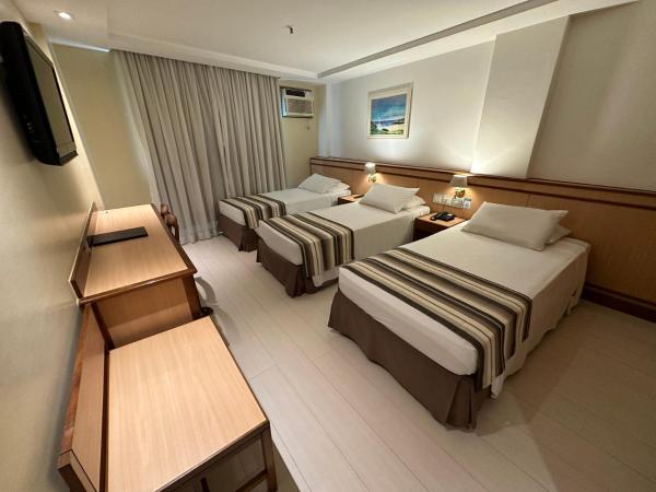 Riale Vilamar Copacabana : photo 2 de la chambre chambre triple de luxe avec 3 lits simples