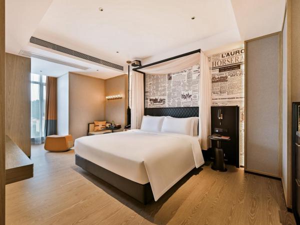 广州萝岗科学城骑士物语酒店Arthur Hotel Luogang Guangzhou-Free Shuttle Bus For Canton Fair : photo 1 de la chambre chambre supérieure lit queen-size
