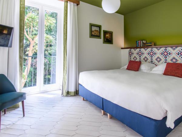 Parco dei Principi : photo 2 de la chambre appartement - vue sur jardin