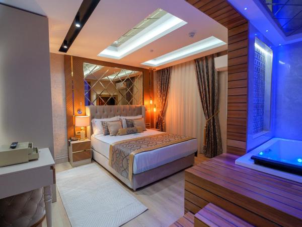 Elysium Deluxe Suites Antalya : photo 1 de la chambre suite deluxe avec baignoire spa