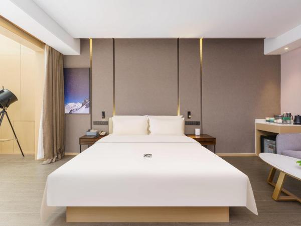 Atour S Hotel Xinghai Square : photo 1 de la chambre jimu double room with garden view