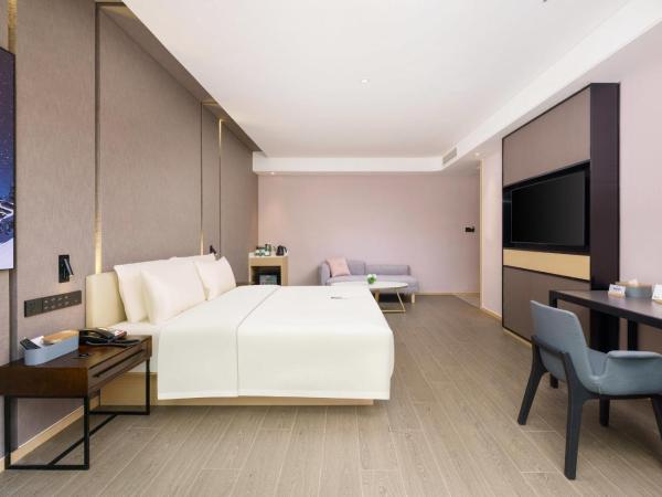 Atour S Hotel Xinghai Square : photo 5 de la chambre jimu double room with garden view