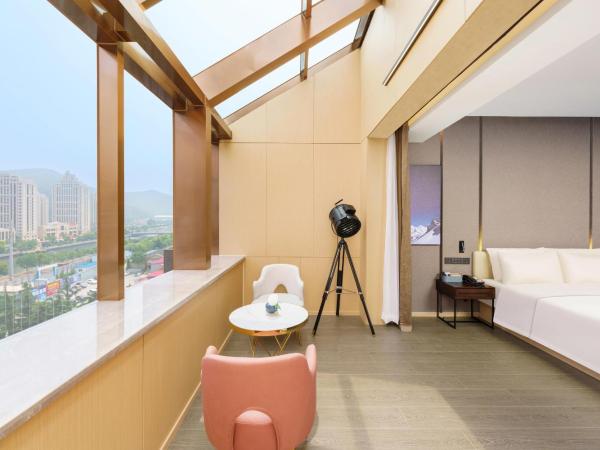 Atour S Hotel Xinghai Square : photo 7 de la chambre jimu double room with garden view