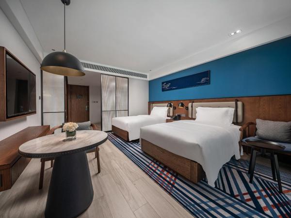 Sanya Haitang Bay Moutai Resort Superior Hotel : photo 2 de la chambre chambre lits jumeaux - vue sur jardin