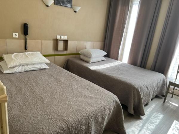 Hôtel Jarry Confort : photo 1 de la chambre chambre triple