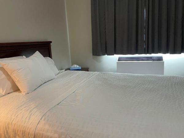 Travelodge by Wyndham London Ontario : photo 1 de la chambre chambre lit queen-size - non-fumeurs