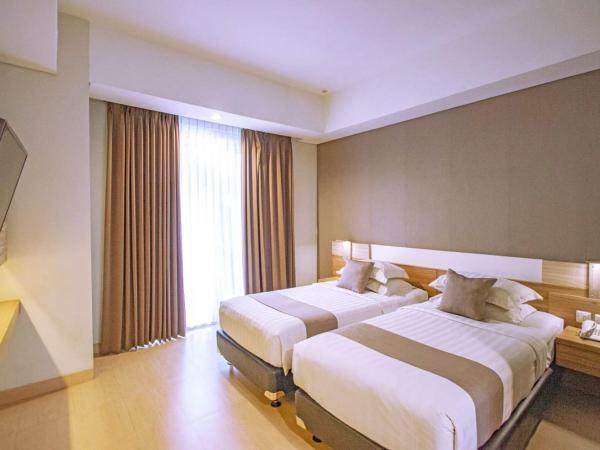 Hotel FortunaGrande Seturan Yogyakarta : photo 1 de la chambre chambre deluxe double ou lits jumeaux