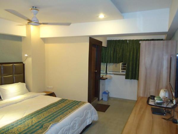 Hotel Maan Residency Satellite Road : photo 3 de la chambre chambre deluxe