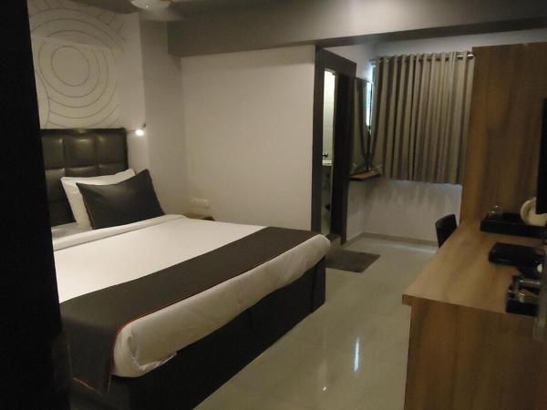 Hotel Maan Residency Satellite Road : photo 1 de la chambre chambre triple exécutive