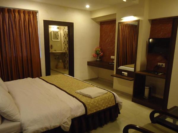 Hotel Maan Residency Satellite Road : photo 5 de la chambre chambre triple exécutive