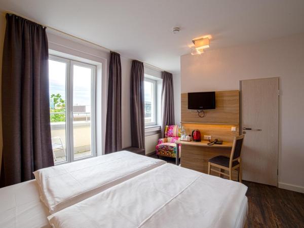 City Hotel Hannover : photo 2 de la chambre chambre double avec salle de bains privative