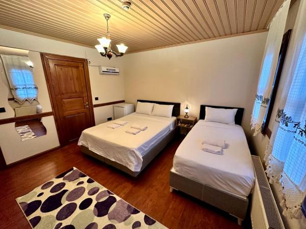 Melkan Otel Guest House : photo 6 de la chambre chambre triple