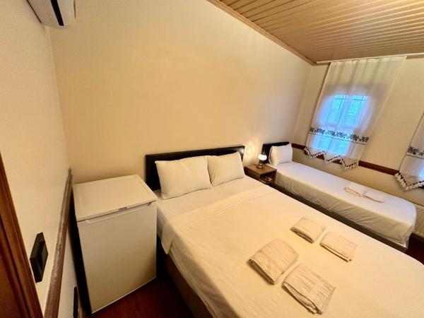 Melkan Otel Guest House : photo 5 de la chambre chambre triple