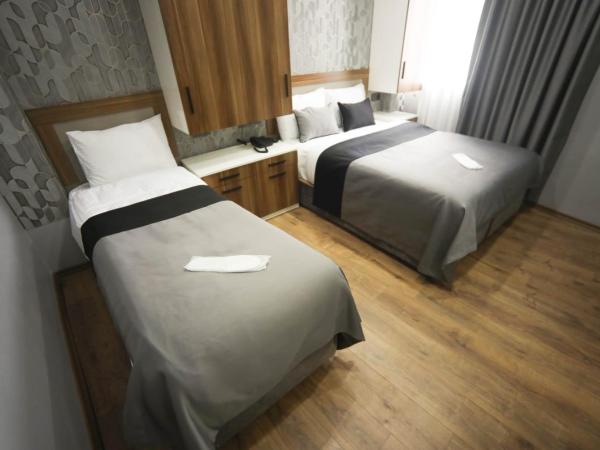 Yuvam akmarmara hotel : photo 9 de la chambre chambre triple basique