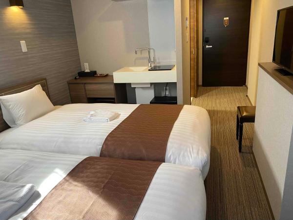 C＆Jホテル : photo 3 de la chambre chambre lits jumeaux
