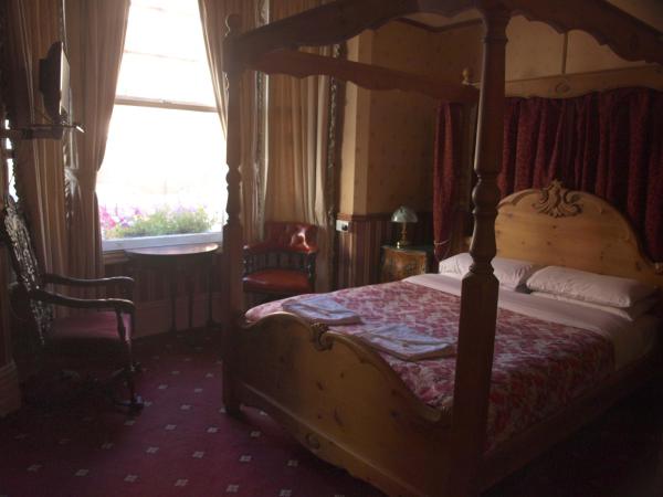 Oakley Hotel : photo 2 de la chambre chambre double avec lit à baldaquin