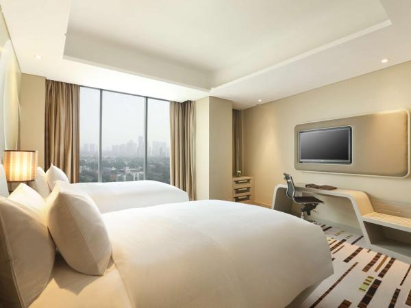 DoubleTree by Hilton Jakarta - Diponegoro : photo 1 de la chambre chambre lits jumeaux deluxe