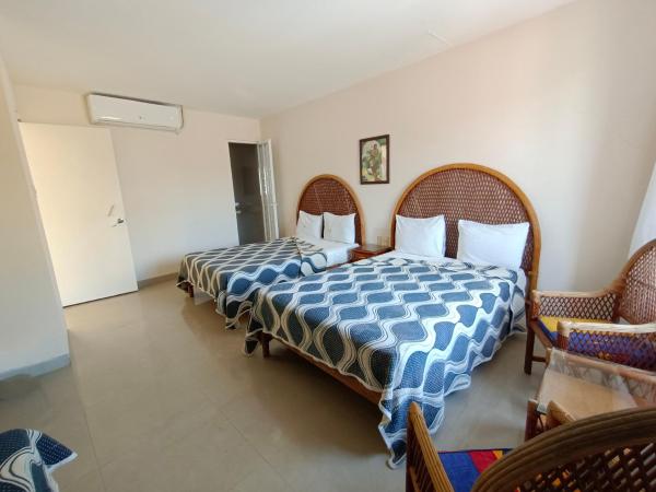 Hotel Playa de Oro - Enfrente de WTC y Plazas Comerciales : photo 3 de la chambre chambre familiale