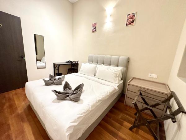 Madras Inn 58-1 : photo 7 de la chambre chambre double standard avec salle de bains commune