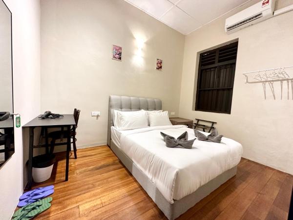 Madras Inn 58-1 : photo 8 de la chambre chambre double standard avec salle de bains commune