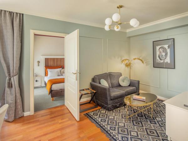 Queen's Court Hotel & Residence : photo 8 de la chambre suite supérieure lit king-size