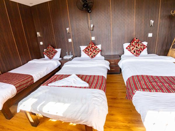 Traveler's Holiday Inn : photo 5 de la chambre chambre familiale deluxe