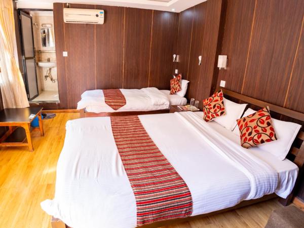 Traveler's Holiday Inn : photo 8 de la chambre deluxe